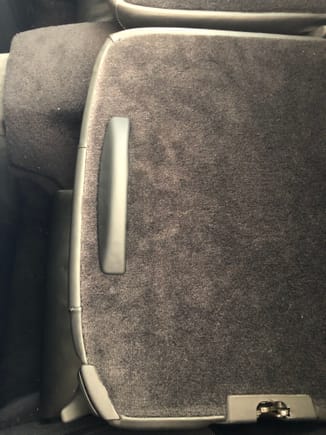 Luggage stopper on back of rear seat