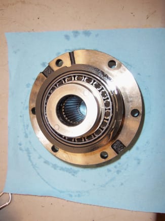 Backside of pinion gear/bearing assembly, showing one of the tapered roller bearings.