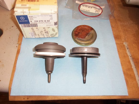 New on left, old on right. Note new uses a teflon sealing ring, while the old used a rubber lip seal.