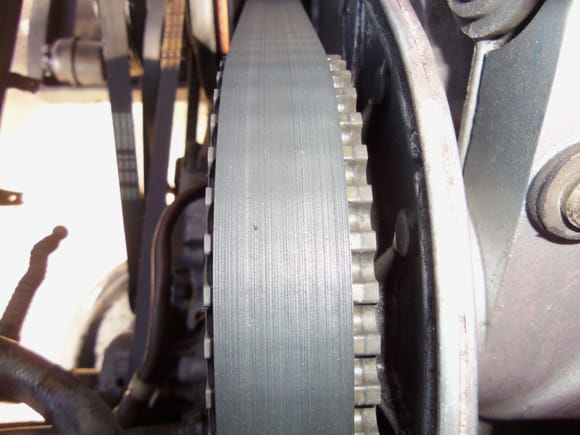 For reference:  this is the tracking on the driver's side sprocket with the old belt and misaligned tensioner roller.
