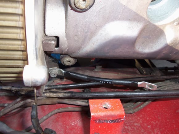 Installed new driver's side ignition coil ground wire at the same time as installing the timing cover back piece.