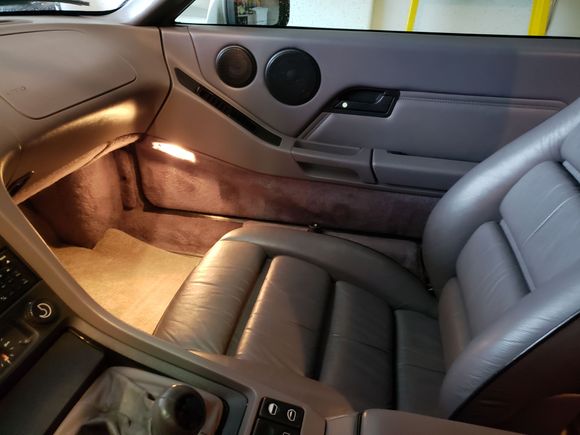 grey interior with black piping on grey seats.