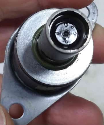 Small circular valve inlet underneath the intake screen.  