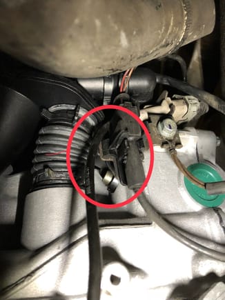 After anot 60 minutes of cussing and discussing I figured out a way. Everything re-assembled and the connector and sensor is barely visible, only the bolt head can be seen. Dodged a bullet for sure.