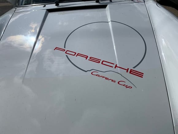 My friend can make up the graphics for the other cup cars. Maybe it is what they need and although they didn't come with it can make up Carrera Cup decal for the engine lid. 