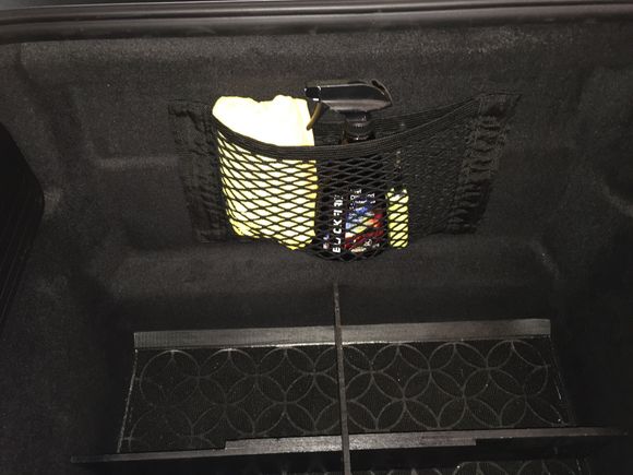 Wanted a way to carry some detail supplies without taking up precious cargo space. Picked up this $14 Velcro Cargo Net off Amazon. It's a perfect fit for our Frunk & looks stock. Velcro holds well, items secure & takes up little space. Easy to tear off if needed. Yes!!!
