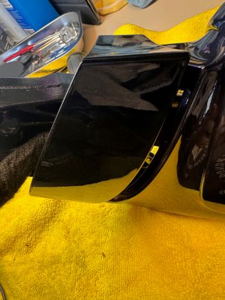 concave end of bottom cap released and tilted away from the base.