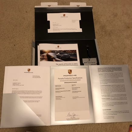 Personalized delivery information including the Porsche Production Specification document signed by Klaus Zelimer, CEO PCNA