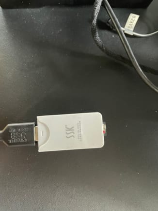 USB cable from Isudar board, with SD memory card in an adapter, or simply use a USB memory stick.