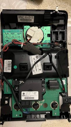 The microphone's wire is the one with small red tape around it in the lower right corner