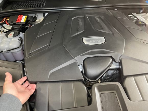 To remove the engine cover, carefully pull up on the left front and then the right front of the cover.