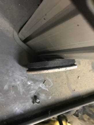 Got a furniture moving rubber/felt plug and etched a groove into it so it will catch the skid plate. The felt part I painted black