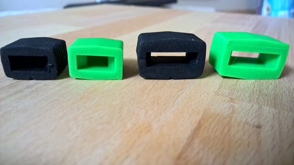Green 3D printed dampers vs black OE dampers.  Same size, different firmness.