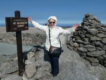 My wife was cold and fighting the wind at the summit.