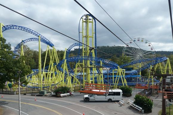 Modern steel coaster and ferris wheel