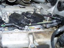 Spark plugs..notice the plastic wire looms are disintegrating due to the age/heat