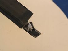 Here you can clearly see the little clip with the little pointy arm bent up that allows the rubber to slide out easily and where new one will slide in. Plan is to bend it down to have the pointy ended arm secure the new rubber when it arrives