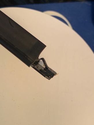 Here you can clearly see the little clip with the little pointy arm bent up that allows the rubber to slide out easily and where new one will slide in. Plan is to bend it down to have the pointy ended arm secure the new rubber when it arrives
