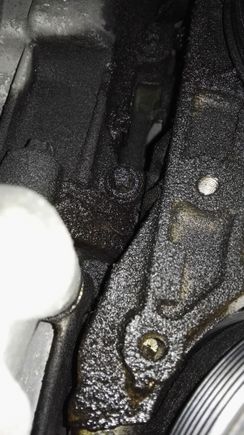 Little higher up from underneath. Ac pump on the right side just below pic...