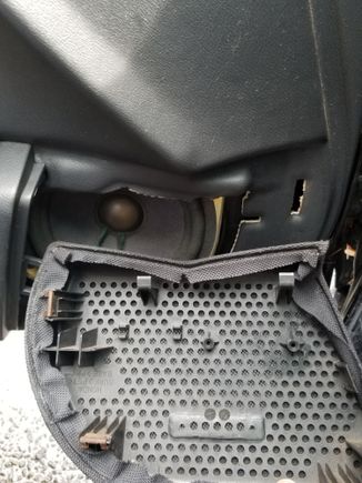 I can't figure how to get the two plastic clips on the top below the door panel. I think that is how the cover is held in place. 