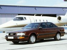 Audi V8 Quattro in brown with Lear jet