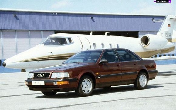 Audi V8 Quattro in brown with Lear jet