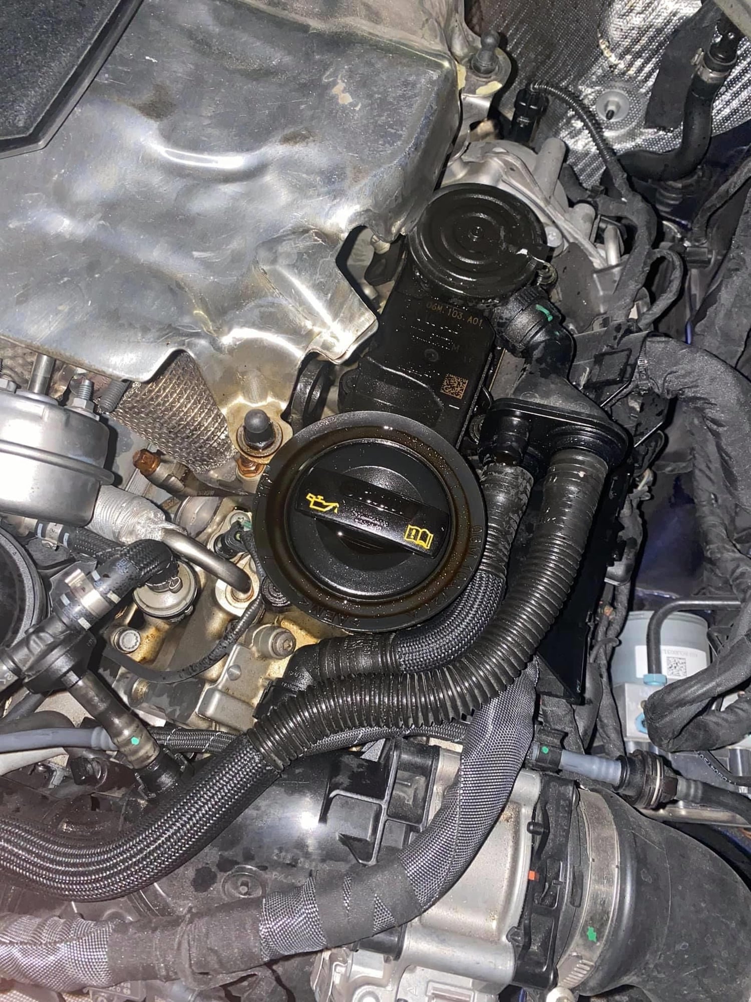 What causes access oil coming out from the breather pipe in a