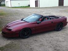 2.75 inch drop, custom wheels, seats. Patriot red sure looks more marroon in the shade, but deep red in the sun light...