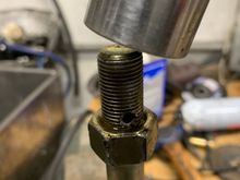 Next put the bolt in the vise again, use some lube and run the nut up and down several times to clean up the threads.