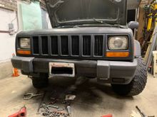The bumper ends took a little clearance grinding on the inboard/lower area, then they bolted on. Even the stock license plat mount bolted on! The customer is going to finish up some more mods to make the winch and d-ring mounts accessible.  