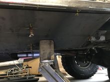 Used a jack to flex the plate into position.