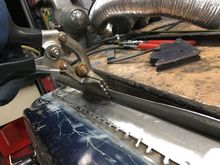 Cleaned up the welds, then started bending the lip over.