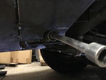 Plasma cut a 3/16” piece and tacked it in. Grab a deep 13/16”  socket and make sure you can access the bolt before ya weld it in.