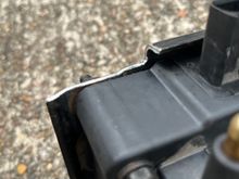 Lower corner trimmed to clear camshaft position sensor