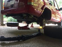 Started in back. As Dirk at DPG suggest would happen, most of upper shock bolts broke. We were able to knock the tack-welded nuts out and fishnew bolts up and through the existing holes with the wire method many talk about. Dirk also recommended we try this method.
