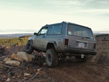 The rear shocks just don't cut it. Shocks for a 3" lift on a 4" lift, don't have a whole heck of a lot of downtravel! This is rear tire lifted slightly.