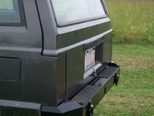 Aggressor Series Rear XJ Bumper with hitch, D-rings, full 3/8" thick Unibody tie-in brackets as well as factory style.
Wraps tightly with body lines and has contoured tail light fillers with optional step pads.  Constructed of solid 3/16" smooth plate and 3/8" brackets.  Mounts with 16 Grade 8 bolts.