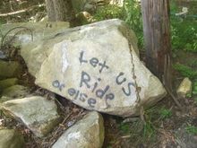 Let us Ride or else. Saw this at the begining of a trail.
