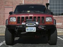 Replaced the .5" spacers with 1.75" spacers to compensate for the weight of the bumper and winch.  Sitting at 4" front and rear now.