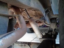 exhaust doesn't look right, and will probably need to be re-run. Pulled the rear sway bar out already. Front bushings ont he leaf springs need to be replaced.