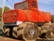 The town I work in has harvest festival every year. One of the contests was to build something with hay. This is what the local tire shop came up with. The only thing supporting it is the 8 by 8s for the frame.