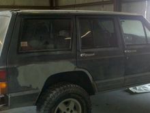 doin alittle bondo work from when i cut the fenders, the body warped alittle after welding in a 1/4 inch round bar