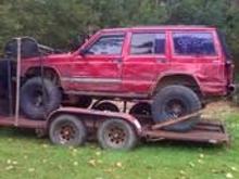 red jeep..a little banged up.. but thats just love