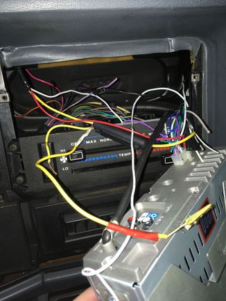 This is how the previous owner had the radio wired in, hard wired to the battery (through the glove box and fender) only one speaker wired up. Got that fixed up 