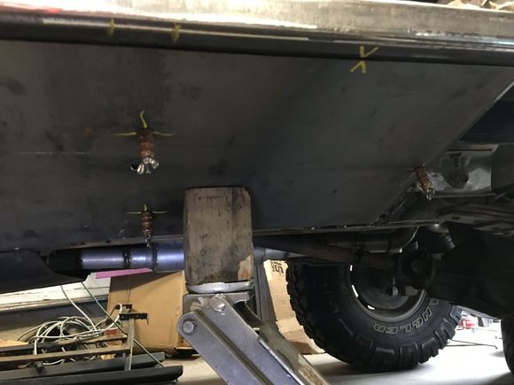 Used a jack to flex the plate into position.