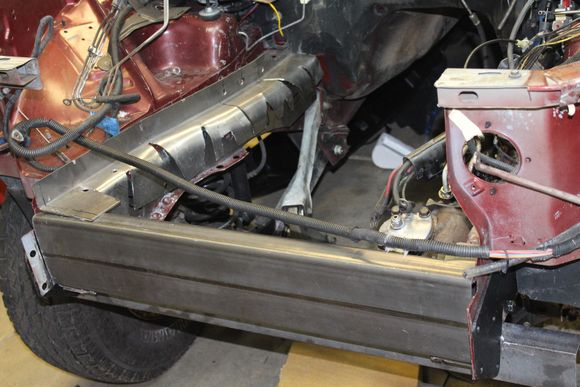 The front of the engine compartment gets tied from pass to drive side with .120 wall 2X5 rectangular tubing. Better to over build it a bit.