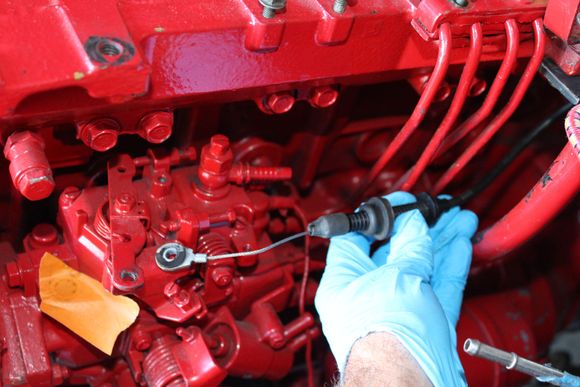 So, I need a throttle bracket and I needed it to hold the original cable at about where i was holding it in this photo.