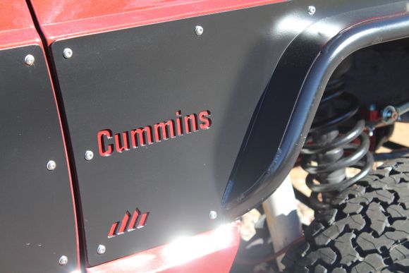 Water-jet cut the fenders with the Cummins name, courtesy of "Dirtbound"