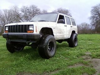 thin put tires on 10 wides with 12.5 wide tires 33s 15 in rim i still am raising the back one more in i have it on the lower shckle mount raise it up this weekend