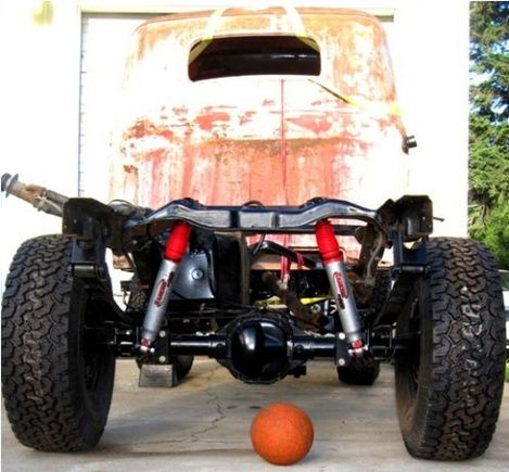 I went with a spring over axle setup and made my own custom shock mounts to replace the whimpy stock setup. They now have 12" of travel and I can lift a tire 15" before the other starts to leave the ground